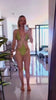 Girl wearing SUZU swimsuit in Pascolo (Olive green)